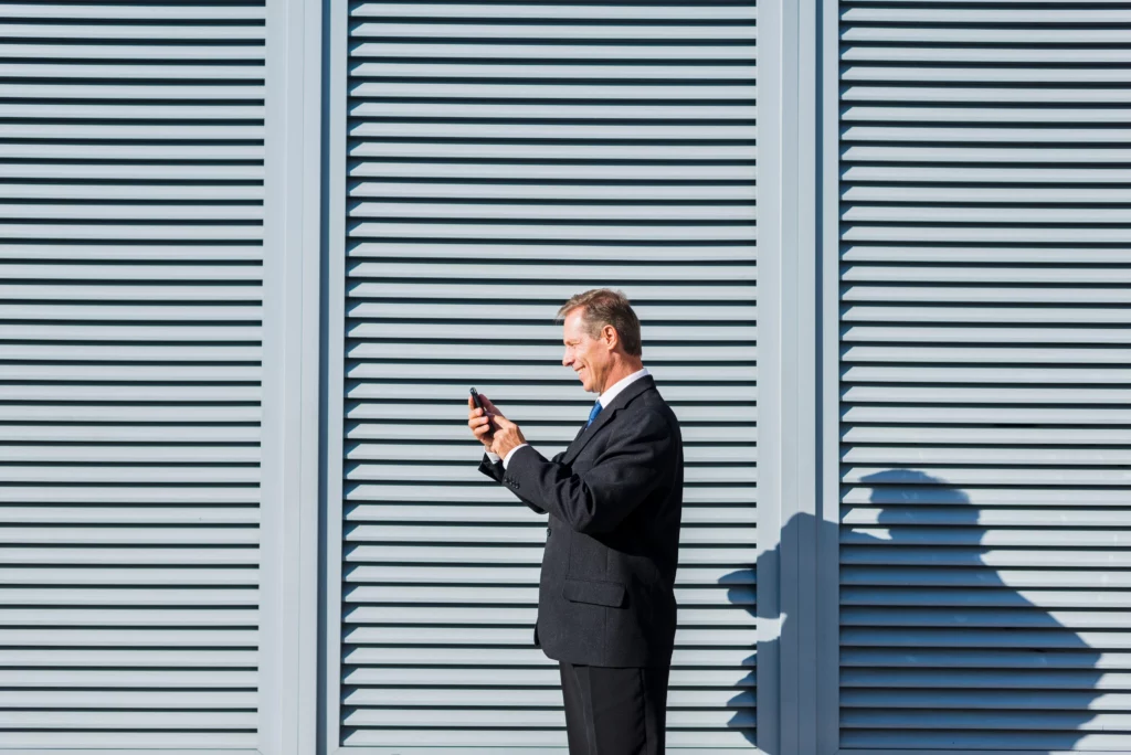 a man stand in font of Rollshutters
